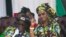 Zimbabwean First Lady Grace Mugabe, right, is seen with her husband Robert Mugabe at a rally in Gweru, Zimbabwe, Sept, 1, 2017. 
