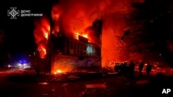 In this photo provided by the Ukrainian Emergency Service, firefighters put out the flames following a Russian rocket attack in Dobropillya, Donetsk region, Ukraine, March 8, 2025.