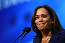 FILE PHOTO: Democratic 2020 U.S. presidential candidate and U.S. Senator Kamala Harris (D-CA) takes the stage at the New Hampshire Democratic Party state convention in Manchester, New Hampshire, Sept. 7, 2019.