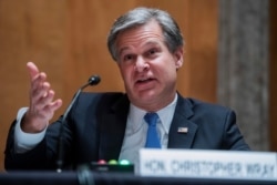FBI Director Christopher Wray testifies during a Senate Homeland Security and Governmental Affairs Committee hearing on Capitol Hill in Washington, Sept. 24, 2020.