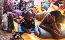 Ethiopian refugee children who fled fighting in Tigray province, rest in a hut at the Um Rakuba camp in Sudan's eastern Gedaref province, on Nov. 16, 2020.