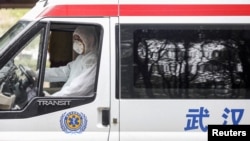 A medical worker drives an ambulance before disinfecting it at Jinyintan hospital in Wuhan, the epicentre of the novel coronavirus outbreak, in Hubei province, China February 14, 2020.