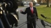 President Donald Trump speaks to reporters on the South Lawn of the White House in Washington, Dec. 4, 2017.