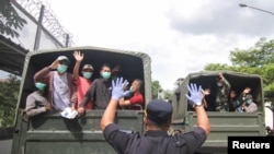 Indonesian prisoners nearing the end of their sentences are released to avoid the possibility of a surge in coronavirus infection in overcrowded prisons, in Depok, near Jakarta, Indonesia, April 2, 2020. (Antara Foto via Reuters)