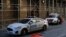 FILE - New York City Police Department (NYPD) officers sit in vehicles outside the District Attorney's Office in New York, March 29, 2023. 