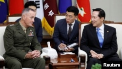 U.S. Chairman of the Joint Chiefs of Staff Gen. Joseph Dunford talks with South Korean Defence Minister Song Young-moo during their meeting at the Defence Ministry in Seoul, South Korea, Aug. 14, 2017. 