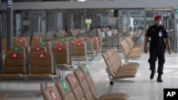 A security person patrols at Suvarnabhumi Airport in Bangkok, July 3, 2020. 