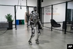 Humanoid robot Figure 01 is demonstrated at Figure AI's test facility in Sunnyvale, California on October 3, 2023. (AP Photo/Jae C. Hong)