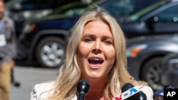 FILE - U.S. President-elect Donald Trump's spokesperson Karoline Leavitt speaks to reporters in New York on May 28, 2024. Leavitt said on Nov. 27, 2024, that some of Trump's Cabinet nominees and appointees had received "violent threats."