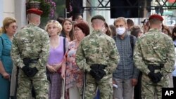 Belarusian police block the street in Minsk, Belarus, July 15, 2020. 