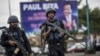 Members of the Cameroonian Gendarmerie patrols in the Omar Bongo Square of Cameroon's majority anglophone South West province capital Buea on October 3, 2018 during a rally in support of Cameroonian President Paul Biya.
