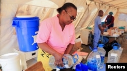 Cholera patients are treated at a local council clinic in Harare
