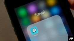 FILE - The Waze application is displayed on a smartphone in San Francisco, March 27, 2017. 
