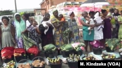 People line up to receive assistance in Mamfe, Cameroon, Dec. 20, 2018