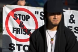 People attend news conference against NYPD's "stop-and-frisk" policies outside the Federal Court, New York, Nov. 1, 2013.