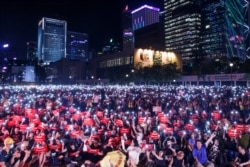 Demonstrators rally ahead of the G-20 summit, urging the international community to back their demands for the government to withdraw the extradition bill in Hong Kong, June 26, 2019.