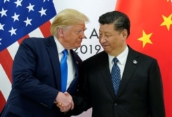 FILE - U.S. President Donald Trump meets with China's President Xi Jinping at the start of their bilateral meeting at the G-20 leaders summit in Osaka, Japan, June 29, 2019.