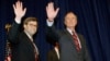 FILE - In this Nov. 26, 1991, photo, President George H.W Bush, right, and William Barr wave after Barr was sworn in as the new attorney general of the United States in Washington. President Donald Trump said Friday he would nominate Barr to serve in the 
