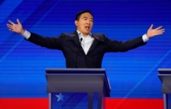 FILE - Entrepreneur Andrew Yang reacts at the 2020 Democratic U.S. presidential debate in Houston, Texas, Sept. 12, 2019.