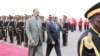 Eritrea's President Isaias Afwerki, left, walks beside Somalia's President Mohamed Abdullahi Farmajo during a welcoming ceremony upon his arrival for a three-day visit to Eritrea, in Asmara, Eritrea, July 28, 2018.