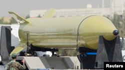 FILE - A military truck carrying a Shahab-3 missile drives by during a military parade commemorating the anniversary of the start of the 1980-1988 Iran-Iraq war, in Tehran, Sept. 21, 2008. 