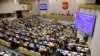 FILE - Russian lawmakers are seen during a vote at the State Duma, the lower house of the Russian parliament, in Moscow, May 8, 2018.