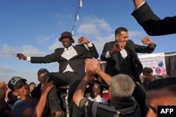 Grooms celebrate during a mass wedding ceremony in Khan Yunis, in the southern Gaza Strip, on May 3, 2024, amid the ongoing conflict between Israel and the Palestinian militant group Hamas.