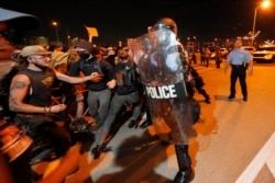 Protesters breach a line of police atop the Crescent City Connection bridge, which spans the Mississippi River in New Orleans, June 3, 2020, during a protest over the death of George Floyd.