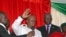 Guinea-Bissau's newly elected president Umaro Cissoko Embalo raises his arm during his swearing-in ceremony in Bissau, Feb. 27, 2020.