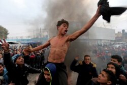 Palestinian students take part in a protest against the U.S. President Donald Trump's Middle East peace plan, in the southern Gaza Strip.