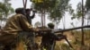 Congolese government army soldiers prepare their weapons at an attack position near Munigi, overlooking the front-line, where they are fighting against M23 rebels outside the eastern Congolese city of Goma, Jul. 15, 2013.