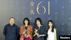 Ma Ying-li, second from right, stands with the crew after winning the Best Narrative Feature award for "An Unfinished Film" at the 61st Golden Horse Awards in Taipei, Taiwan, Nov. 23, 2024. Ma is the wife of the film's director, Lou Ye.