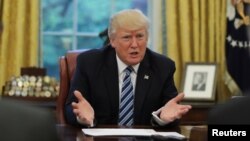 U.S. President Donald Trump speaks during an interview with Reuters in the Oval Office of the White House in Washington, April 27, 2017. 