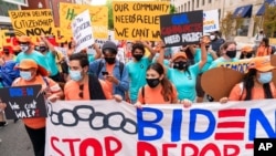 Supporters of immigration reform march while asking for a path to citizenship and an end to detentions and deportations, April 28, 2021, in Washington. 