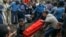 The coffin of one of those killed in the collapse of a mountain of trash at a garbage dump arrives for burial at the Gebrekristos church in Addis Ababa, Ethiopia, March 13, 2017.