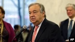 United Nations Secretary-General Antonio Guterres talks with members of the U.N. staff at U.N. headquarters, Jan. 3, 2017. 