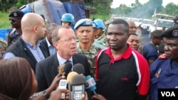 MONUSCO Chief Martin Kobler (wearing suit) with North Kivu governor Julien Paluku (wearing red) at the ambush site in Beni territory, eastern Congo, May, 2015. (Nicholas Long/VOA)