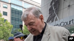 First responders salute as a U.S. flag is unfurled at the Pentagon in Washington, Sept. 11, 2022, at sunrise on the morning of the 21st anniversary of the 9/11 terrorist attacks.
