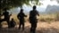 FILE - Soldiers of Karen National Union (KNU) stand guard in Hpa-an village, Karen State, Myanmar. 
