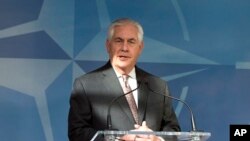 FILE - U.S. Secretary of State Rex Tillerson addresses the press before a meeting of NATO foreign ministers at NATO headquarters in Brussels, March 31, 2017. 