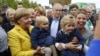 German Chancellor Angela Merkel visits harvest festival in Lauterbach, Germany, Sept. 23, 2017, ahead of the nation's general election on Sept. 24.