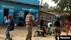 FILE - Peacekeepers serving in the United Nations Organization Stabilization Mission in the Democratic Republic of the Congo (MONUSCO) patrol the streets of Uvira, South Kivu, in the Democratic Republic of Congo, Sept. 30, 2017.