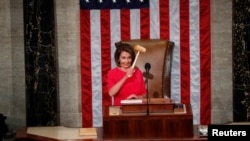 Nancy Pelosi holds the speaker's gavel after being elected speaker as the U.S. House of Representatives meets for the start of the 116th Congress inside the House Chamber on Capitol Hill in Washington, Jan. 3, 2019. 