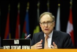 FILE - NATO Deputy Secretary General, Ambassador Alexander Vershbow, speaks at the Parliamentary Assembly's spring session in Tirana, Albania, May 30, 2016.
