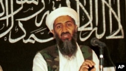 FILE - In this 1998 photo made available on March 19, 2004, Osama bin Laden is seen at a news conference in Afghanistan. 