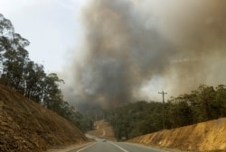 Smoke from a fire at Batemans Bay, Australia, billows into the air, Jan. 4, 2020.