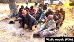 Elders light a fire at a border post in eastern Namibia.