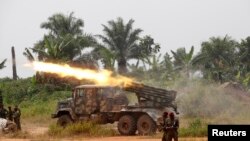 Police officers from explosive ordinance disposal stand next to a deactivated bomb in the Wan Chai district of Hong Kong. Hong Kong police neutralized the large unexploded wartime bomb after it was unearthed during construction work in the Asian financial center.