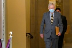 Senate Majority Leader Mitch McConnell of Kentucky walks to the Senate floor on Capitol Hill in Washington, Dec. 30, 2020.