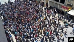 In this citizen journalism image made on a mobile phone, Syrian anti-government protesters gather in the coastal town of Banias, May 6, 2011